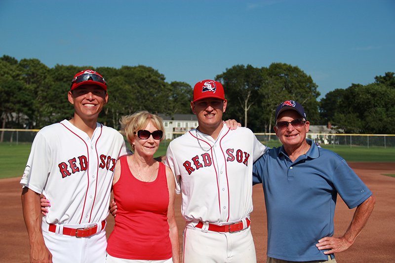 College baseball players with their host family